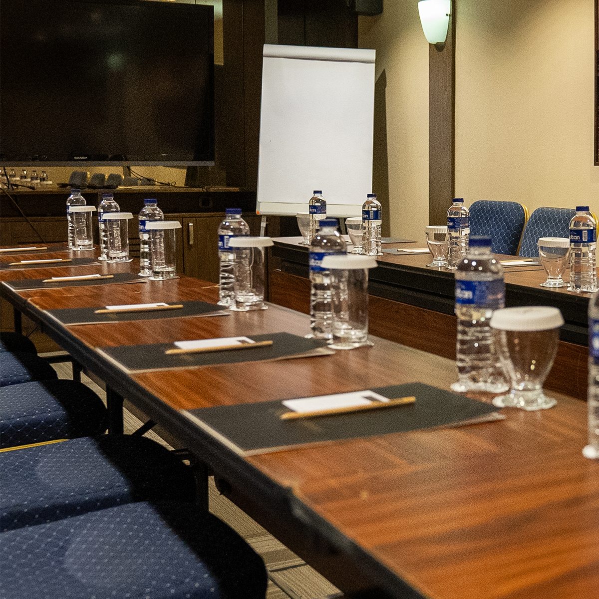 Meeting table, with water and notepads