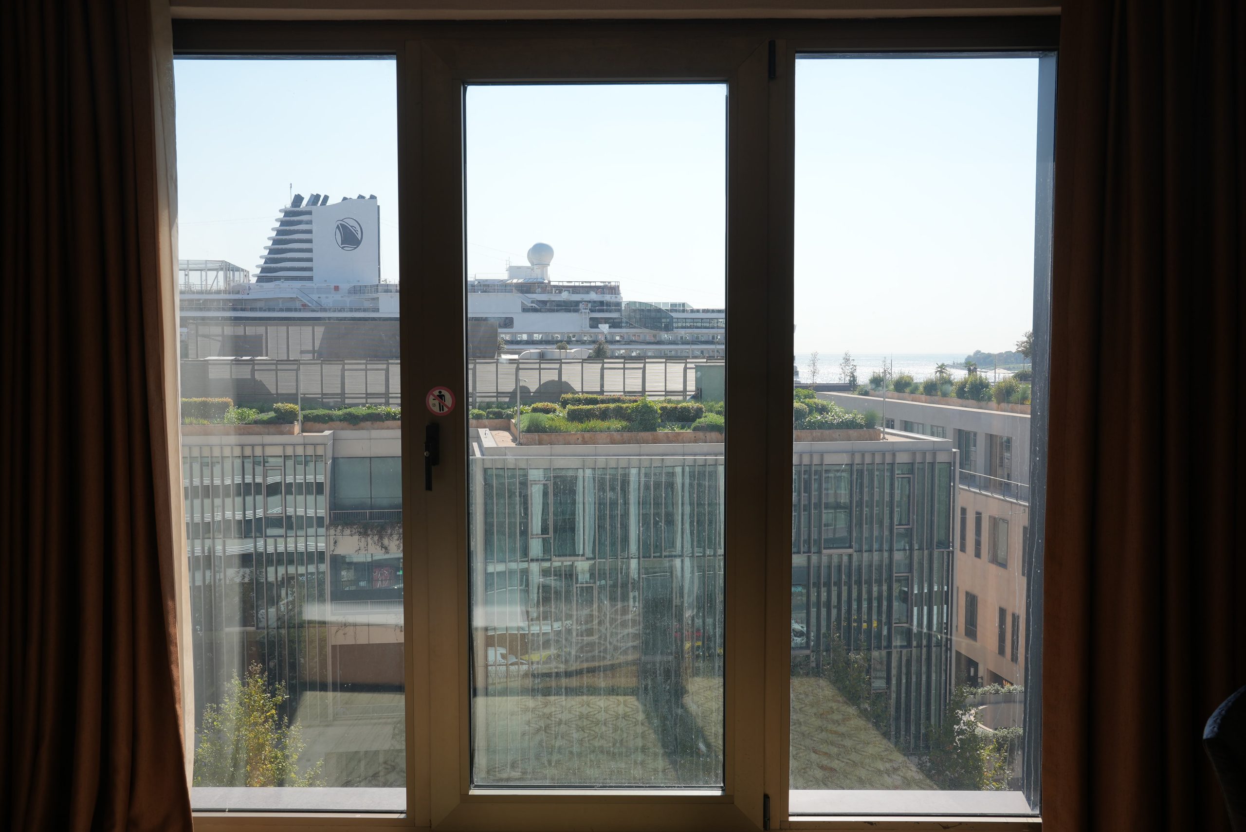 Galataport and a partial sea view through the glass door