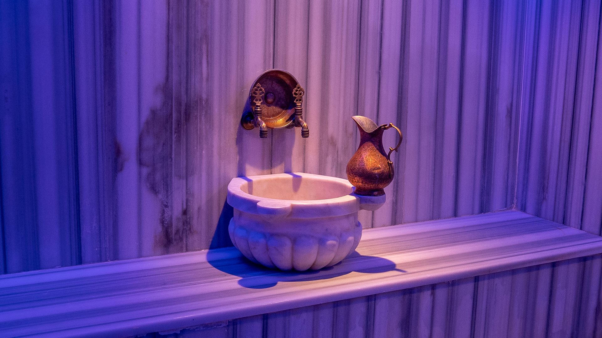 Marble basin and copper ewer in the Turkish bath